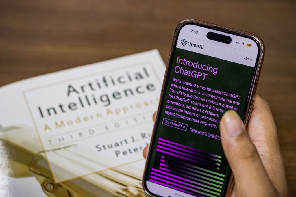 a phone displaying ChatGPT's website