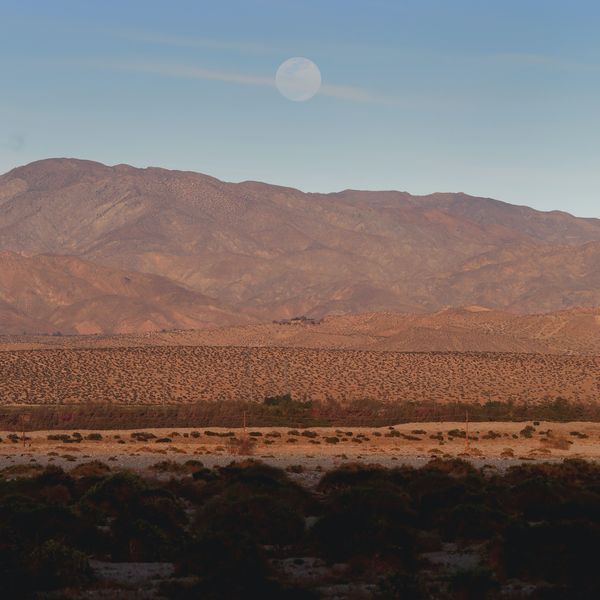 Palm Springs mountainside with moon in sky